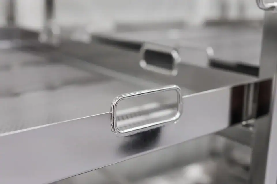 RVS autoclaaf beladingswagen plateauhandgreep detail